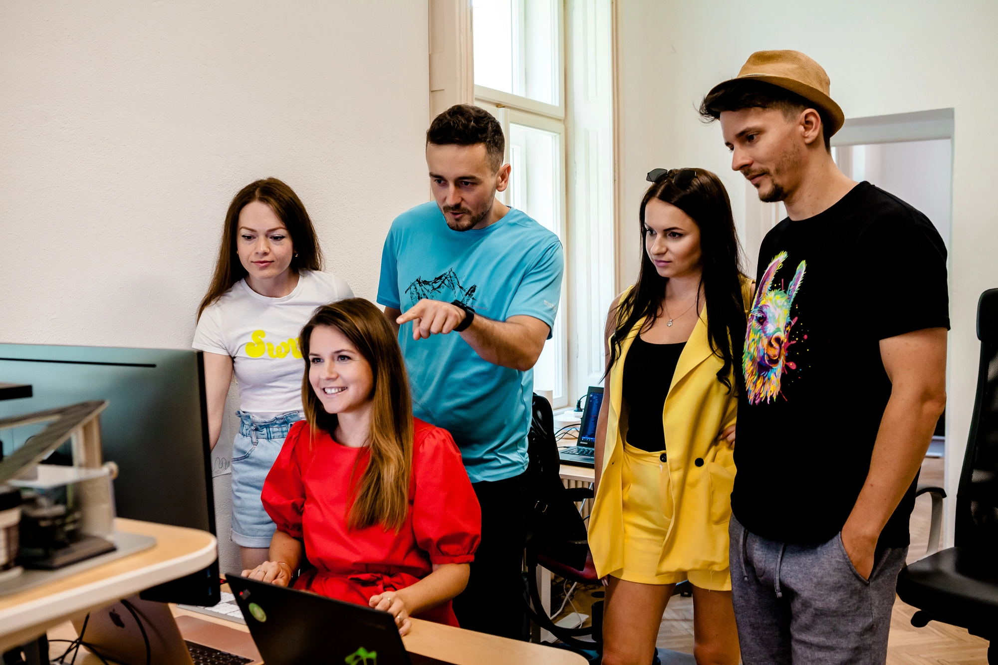 The FatChilli team working at a computer.